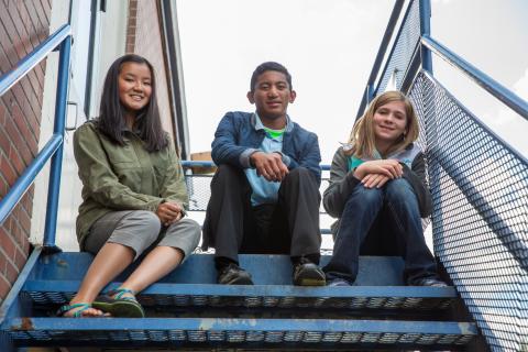 Youth sitting on a school stairway